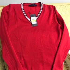 This is all cotton Ivy sweater by Tommy Hilfiger.